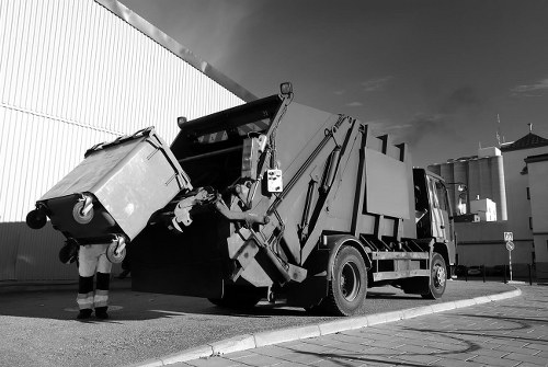 Builders waste clearance in process at a construction site in Feltham